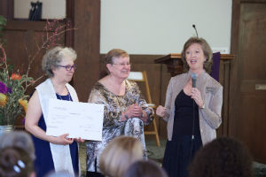 ChI Founder Rev. Gina Rose Halpern, left, holds $80,000 donation from Interfaith Studies' student Mary Lee Dodd, center, with ChI Executive Director Vicki Weiland at the Spring 2017 Ordination and Credentialing Ceremony ChI Founder Rev. Gina Rose Halpern, left, holds $80,000 donation from Interfaith Studies' student Mary Lee Dodd, center, with ChI Executive Director Vicki Weiland at the Spring 2017 Ordination and Credentialing Ceremony